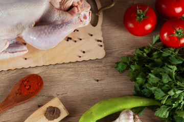 Raw chicken on wooden table