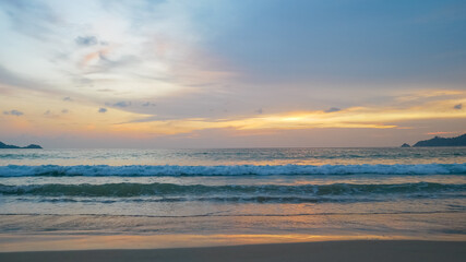 Naklejka na ściany i meble beautiful colourful twilight sky background and sea beach