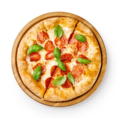 Pepperoni pizza with basil leaves on wooden board isolated. Top view of sliced pizza.