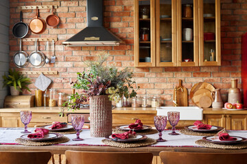 Serving for dinner on kitchen table. Warm kitchen background interior.