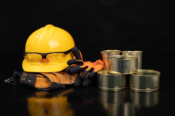 Metal cans with food. Work clothes and food for the production worker.