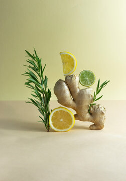 ingredients for ginger lemonade on a colored background, vertical orientation, copy space