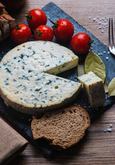 Fourme d'ambert cheese and bread with cherry tomato