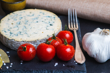 Fourme d'ambert cheese and bread with cherry tomato