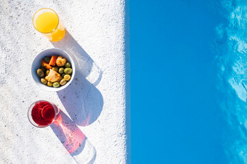 Drinks and snacks by the pool.Top view.Copy space. Relax and resting time in summertime