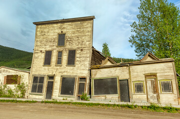 Abandoned Gold Rush era 3rd Avenue hotel complex, damaged by the permafrost, Dawson city, Yukon...
