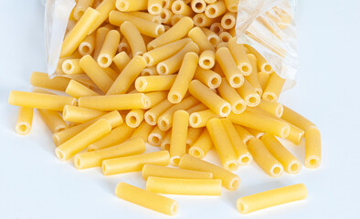 Macaroni poured from a bag