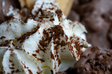 Closeup of texture of delicious wipe cream with cocoa powder on top, Macro with shallow dof