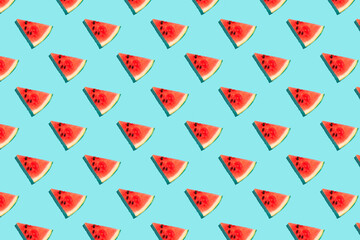 Top view of watermelon slices on blue background. Watermelon colorful pattern