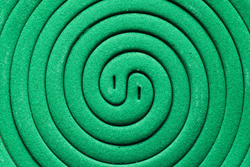 Fototapeta na wymiar Mosquito repellent incense. Two green spirals, top view