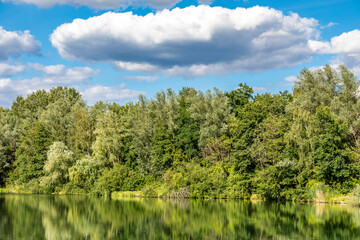 The lake called Oberwaldsee next to Darmstadt, Germany at a cloudy but bright day in summer.