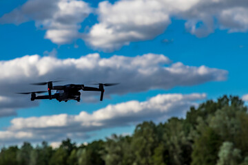 Frankfurt, Germany - 30th June 2020: A german photographer testing his new drone DJI Mavic Air 2, taking pictures of it while flying.