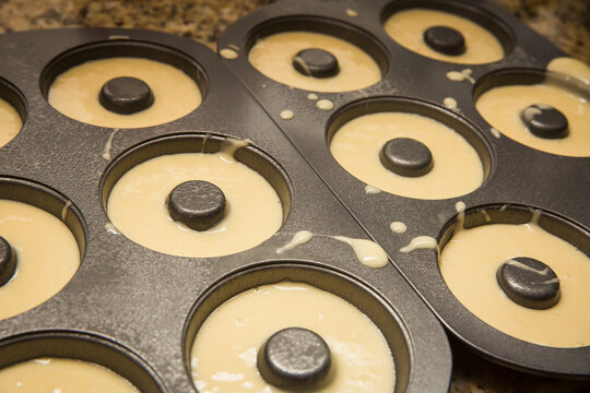 Homemade Donut Batter in Metal Donut Baking Pan
