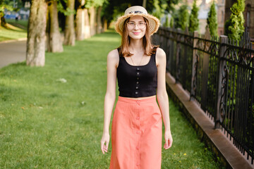 woman tourist in summer light clothes in the middle of the old city