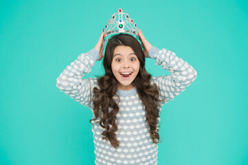 So pleased. Princess concept. Girl princess. Lady small baby princess. Number one. Kid wear golden crown symbol of princess. Girl cute baby wear crown blue background. Success and happiness