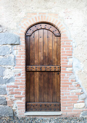 Original medieval wooden door; photo taken in Italy
