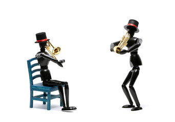 Two black wooden Artist's Figure as musicians isolated on white.Studio shot