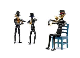 Three black wooden Artist's Figure as musicians isolated on white.Studio shot