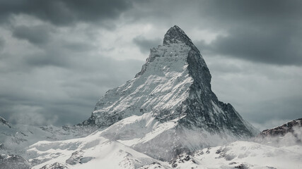 view to the majestic Matterhorn mountain in front of cloudy sky - obrazy, fototapety, plakaty