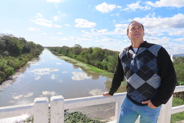Fototapeta premium portrait of a man on the bridge