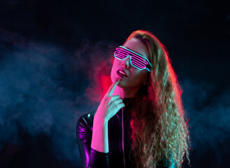 Futuristic woman wearing glasses with neon light.