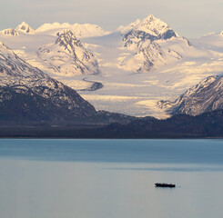 Grewingk Glacier glows with the pink of sunset on the shores of Kachemak Bay - 362687575