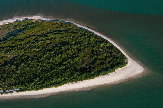 Brazil, Florianopolis. Panoramic aerial view of Daniela beach pontal peninsula and river showing sea, sand and trees.