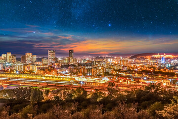 Pretoria city lit up at night with twilight and stars in the sky in Gauteng South Africa