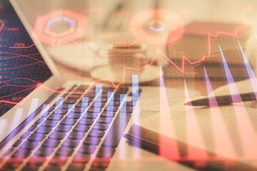 Double exposure of financial chart drawing and desktop with coffee and items on table background. Concept of forex market trading