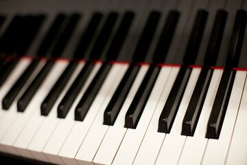 row of black and white piano keys on a Piano keyboard.