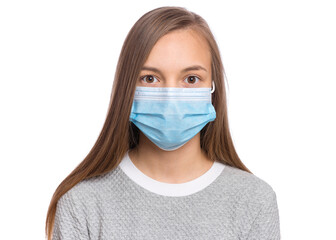 Concept of coronavirus quarantine. Girl wearing medical protective mask to health protection from influenza virus, isolated on white. Portrait of child in face mask. COVID-19 - home self isolation.