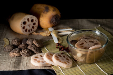 Lotus root soup with beans in a bowl and Chinese herbs, shiitake mushroom, lotus root