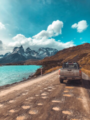 Pick Up truck on scenic dirt road in Torres del Paine National Park © Cavan