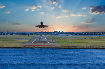 Plane Taking Off in Boston Sunrise