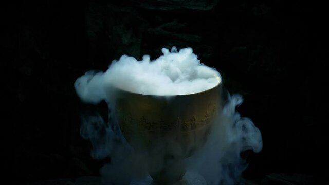Pouring A Magic Potion Into Gold Cup Smoking And Bubbling