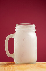 Frosty mug on a colorful background
