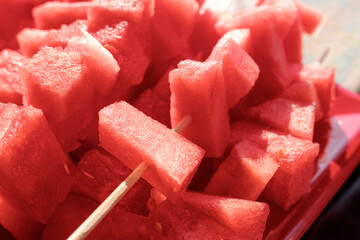 Fresh diced watermelon and skewered as a snack.