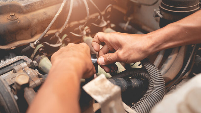 Mechanic Is Fixing Old Car Engine