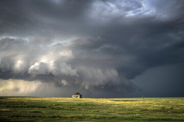 Abandoned farmstead structures on the Great  Plains with Dramatic Skies Overhead