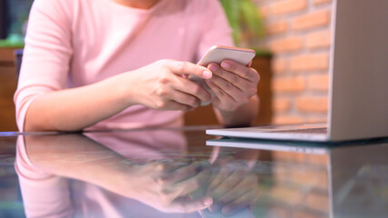 Asian woman online shopping. Social distancing and New normal lifestyle.