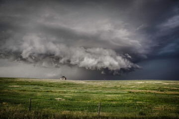 Abandoned farmstead structures on the Great  Plains with Dramatic Skies Overhead
