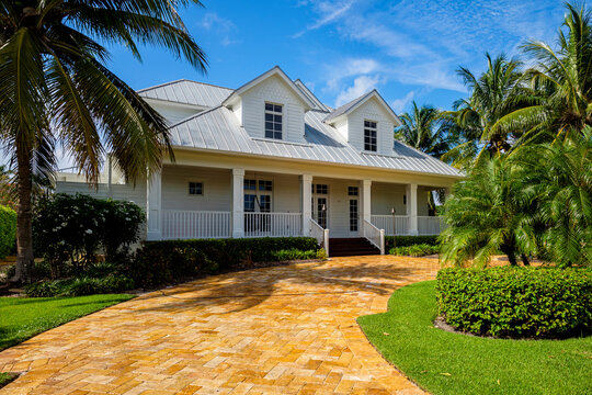 Beautiful Wood Frame Architecture Style Home With New Aluminum Style Roof In The Coastal Residential Historic District Of Naples.