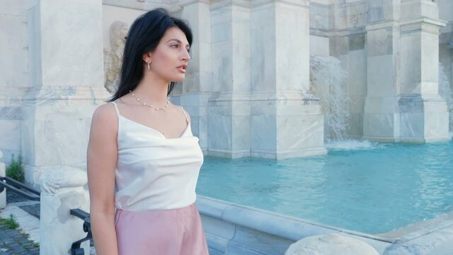 Confident sexy woman walking around the janiculum fountian. Confidence, Beauty