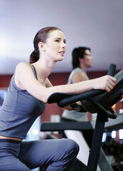 Fototapeta na wymiar Woman exercising in a gym