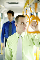 Corporate people standing in the train