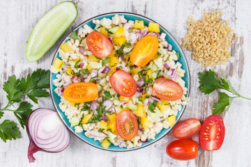 Fresh salad with vegetables and bulgur groats. Healthy meal containing natural vitamins and minerals