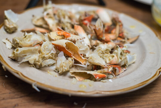 Shells of crab left on plate after finishing meal