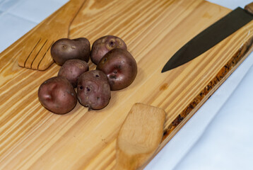 regional potatoes from the Andes at a market in Peru, Bolivia, Argentina, south america on a wooden table. Selective focus