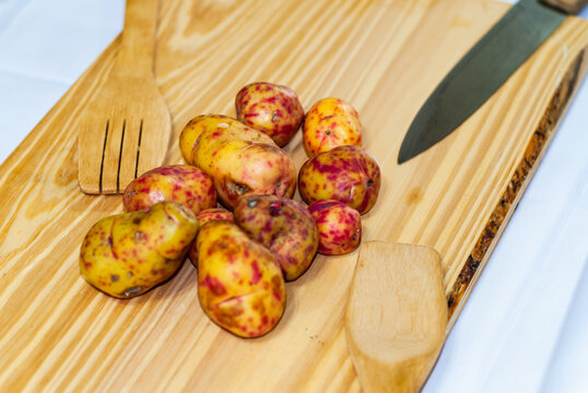 regional potatoes from the Andes at a market in Peru, Bolivia, Argentina, south america on a wooden table. Selective focus