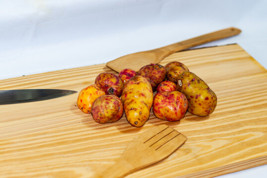 regional potatoes from the Andes at a market in Peru, Bolivia, Argentina, south america on a wooden table. Selective focus